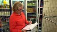 Volunteer checking daily tasks at Church Fenton Community Shop