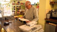 Checking the paper order at Church Fenton Community Shop
